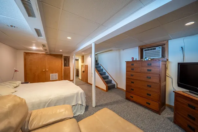 a bedroom with a bed and furniture