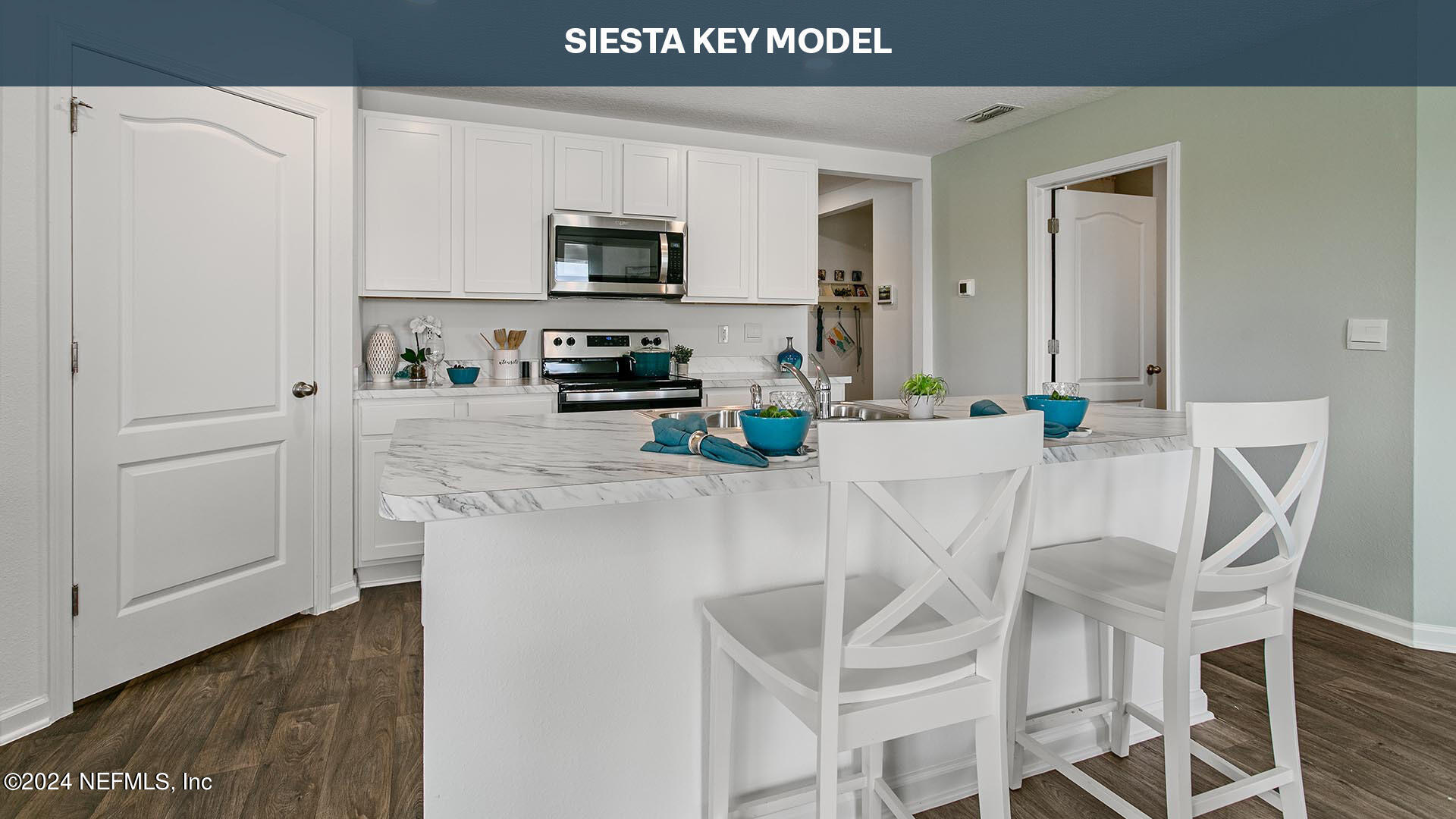 12355 Great Eagle Road Jacksonville, FL 32219 - Photo 7 of 47 a kitchen with stainless steel appliances a microwave a sink and cabinets