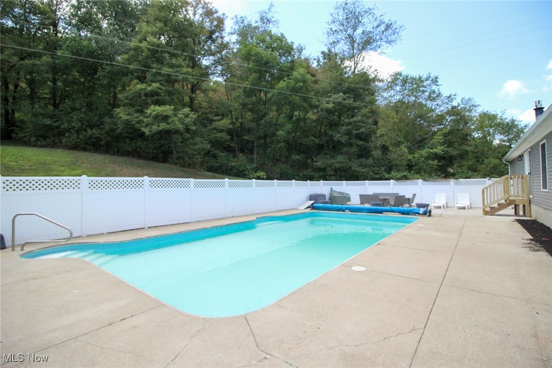 1798 Campbell Road Southwest New Philadelphia, OH 44663 - Photo 43 of 50 View of swimming pool featuring a patio