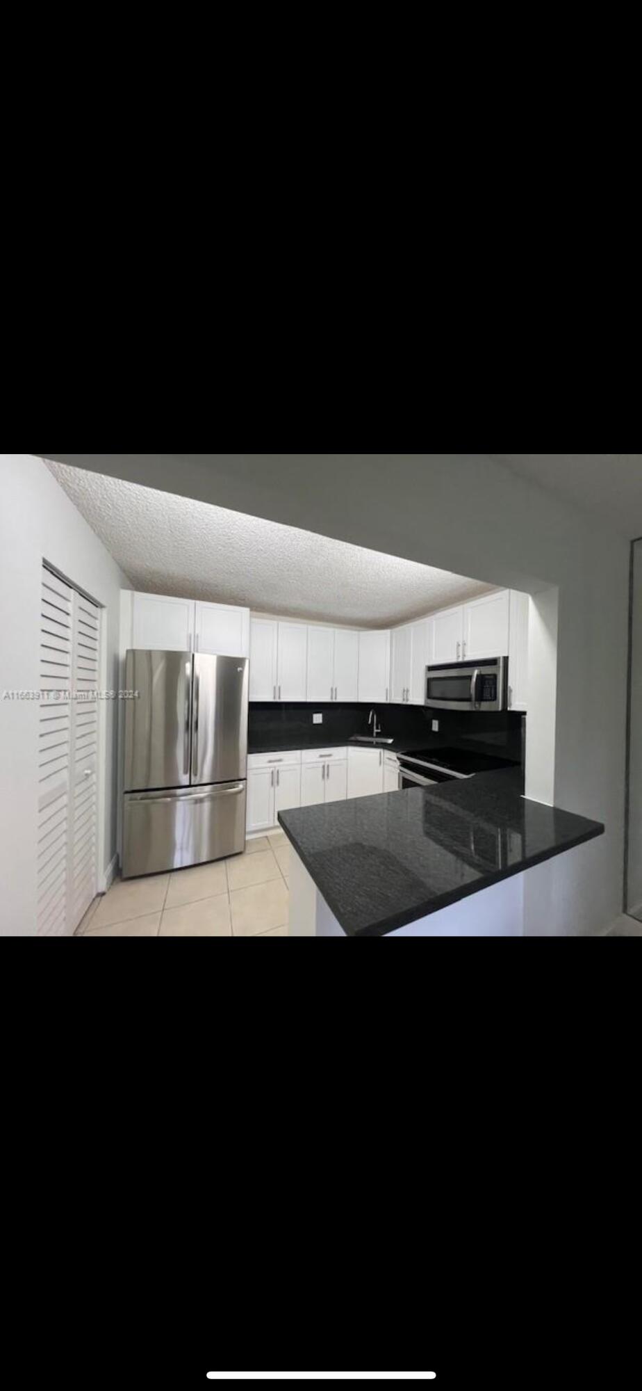 307 Pine Ridge Circle, Unit C1 Greenacres, FL 33463 - Photo 2 of 13 IMG_4755