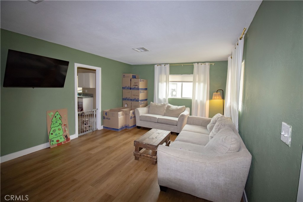 3013 Cornell Street Bakersfield, CA 93305 - Photo 5 of 20 a living room with furniture and a flat screen tv