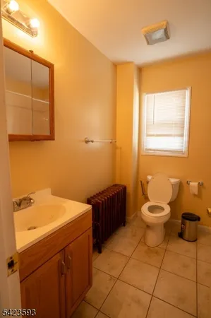 a bathroom with a toilet and a sink