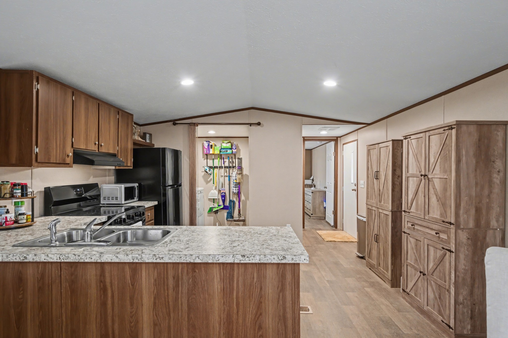 116 Lee Lane Big Rock, TN 37023 - Photo 11 of 34 a kitchen with stainless steel appliances granite countertop a sink refrigerator and cabinets