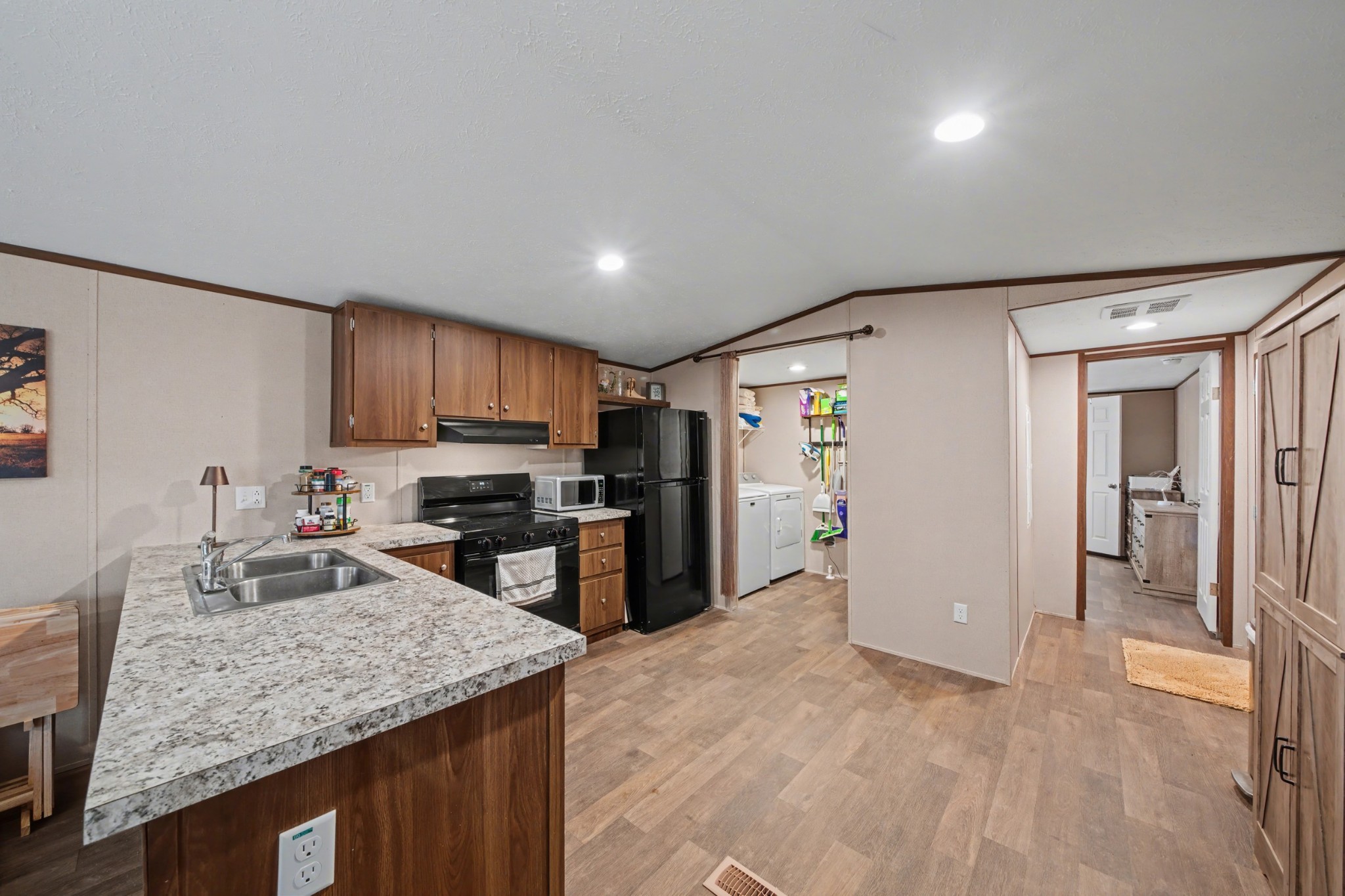 116 Lee Lane Big Rock, TN 37023 - Photo 12 of 34 a kitchen with stainless steel appliances granite countertop a sink refrigerator and cabinets