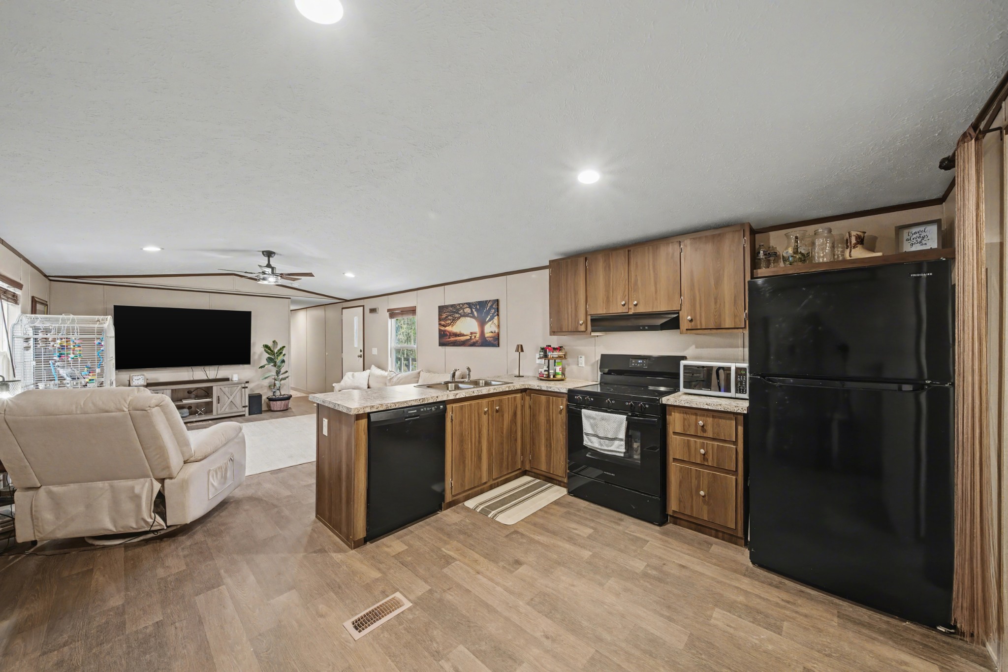 116 Lee Lane Big Rock, TN 37023 - Photo 16 of 34 a large open kitchen with a refrigerator stove top oven and sink