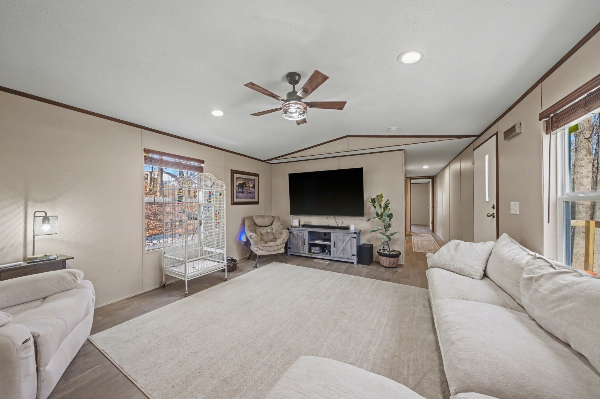 116 Lee Lane Big Rock, TN 37023 - Photo 10 of 34 a living room with furniture a ceiling fan and a flat screen tv