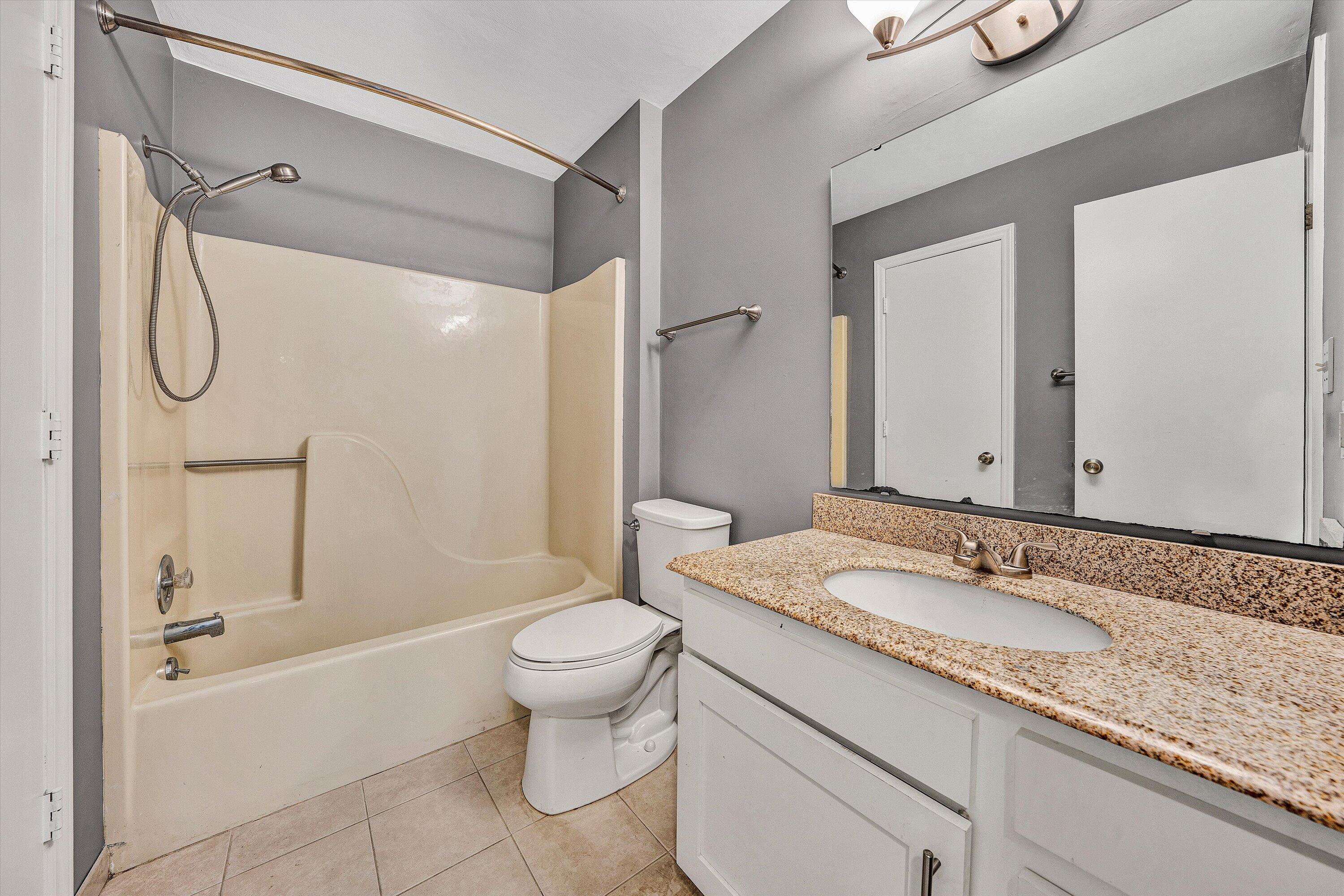 3349 Forest Ridge Road, Unit 3349 Roanoke, VA 24018 - Photo 11 of 20 a bathroom with a granite countertop sink toilet and shower