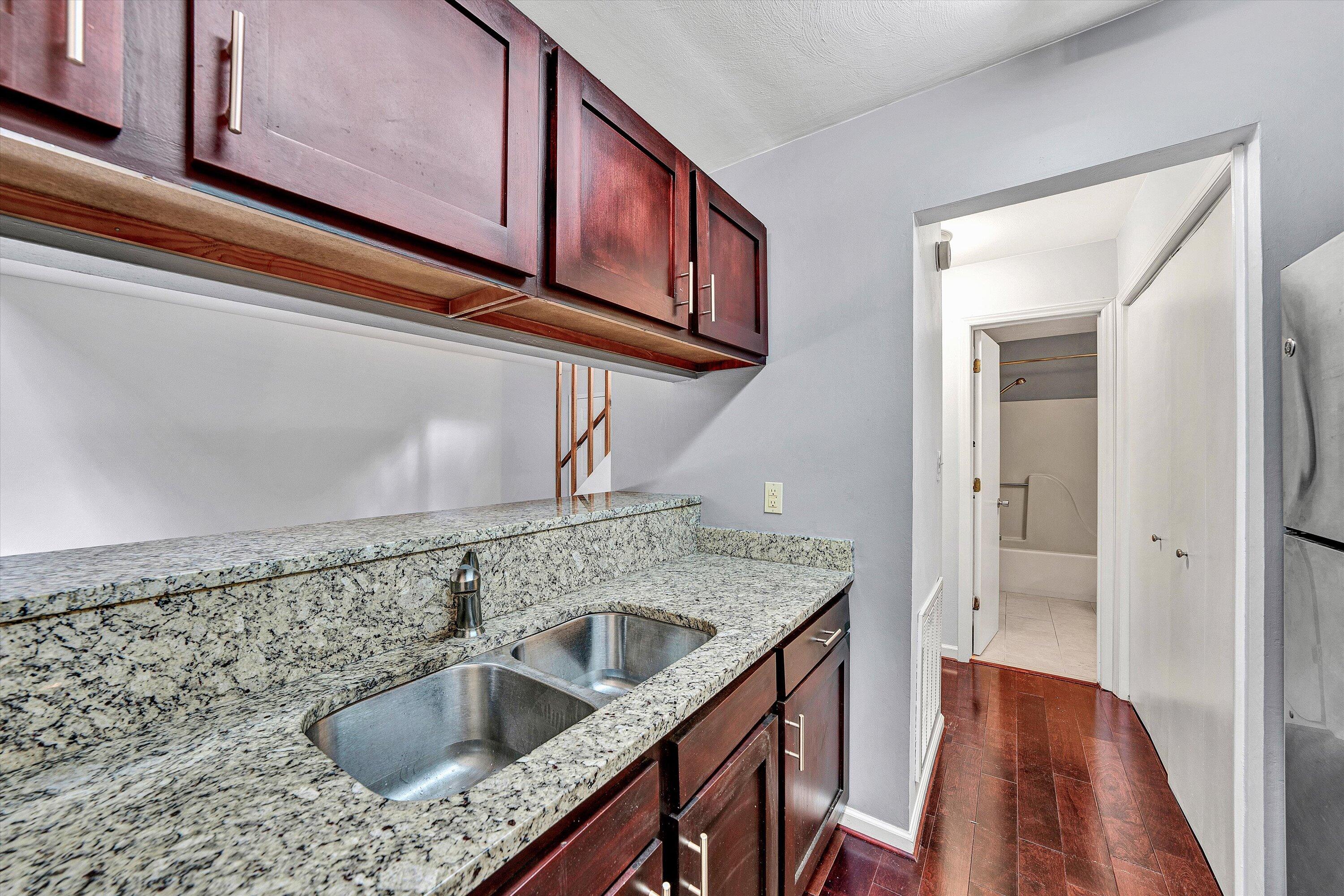 3349 Forest Ridge Road, Unit 3349 Roanoke, VA 24018 - Photo 7 of 20 a kitchen with stainless steel appliances granite countertop a sink and cabinets