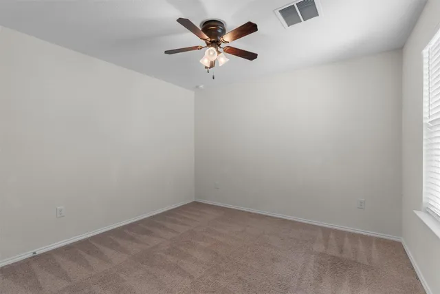 a view of a room with shelf on the wall