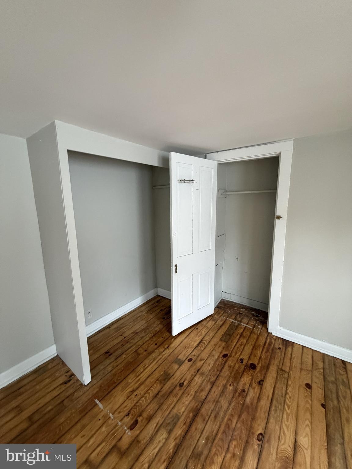 190 7th Street, Unit 1 Salem, NJ 08079 - Photo 12 of 16 an empty room with wooden floor and closet