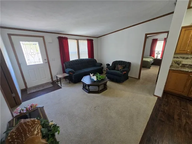 a bed sitting in a room next to a window