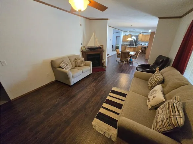 a view of a balcony with wooden floor and outdoor space