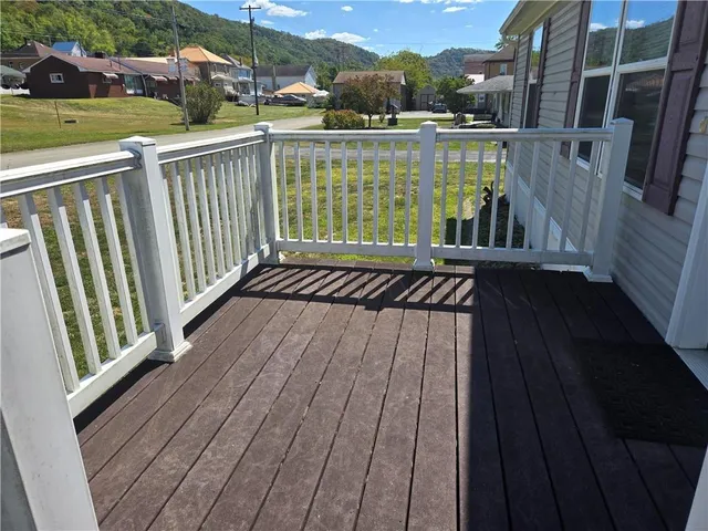 a view of a swimming pool with an outdoor seating