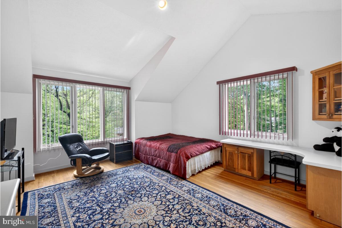10320 Glen Road Potomac, MD 20854 - Photo 32 of 75 a bedroom with furniture and a large window