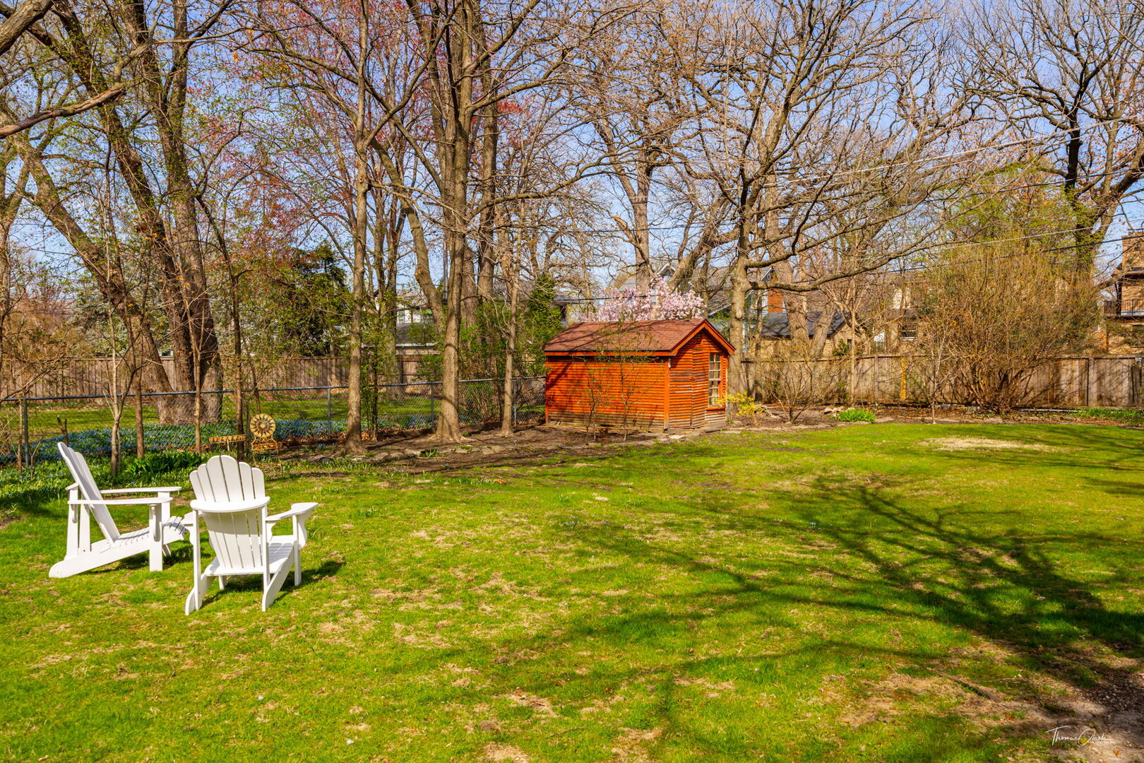 225 Maplewood Road Riverside, IL 60546 - Photo 29 of 39 a view of a swimming pool with a bench and trees