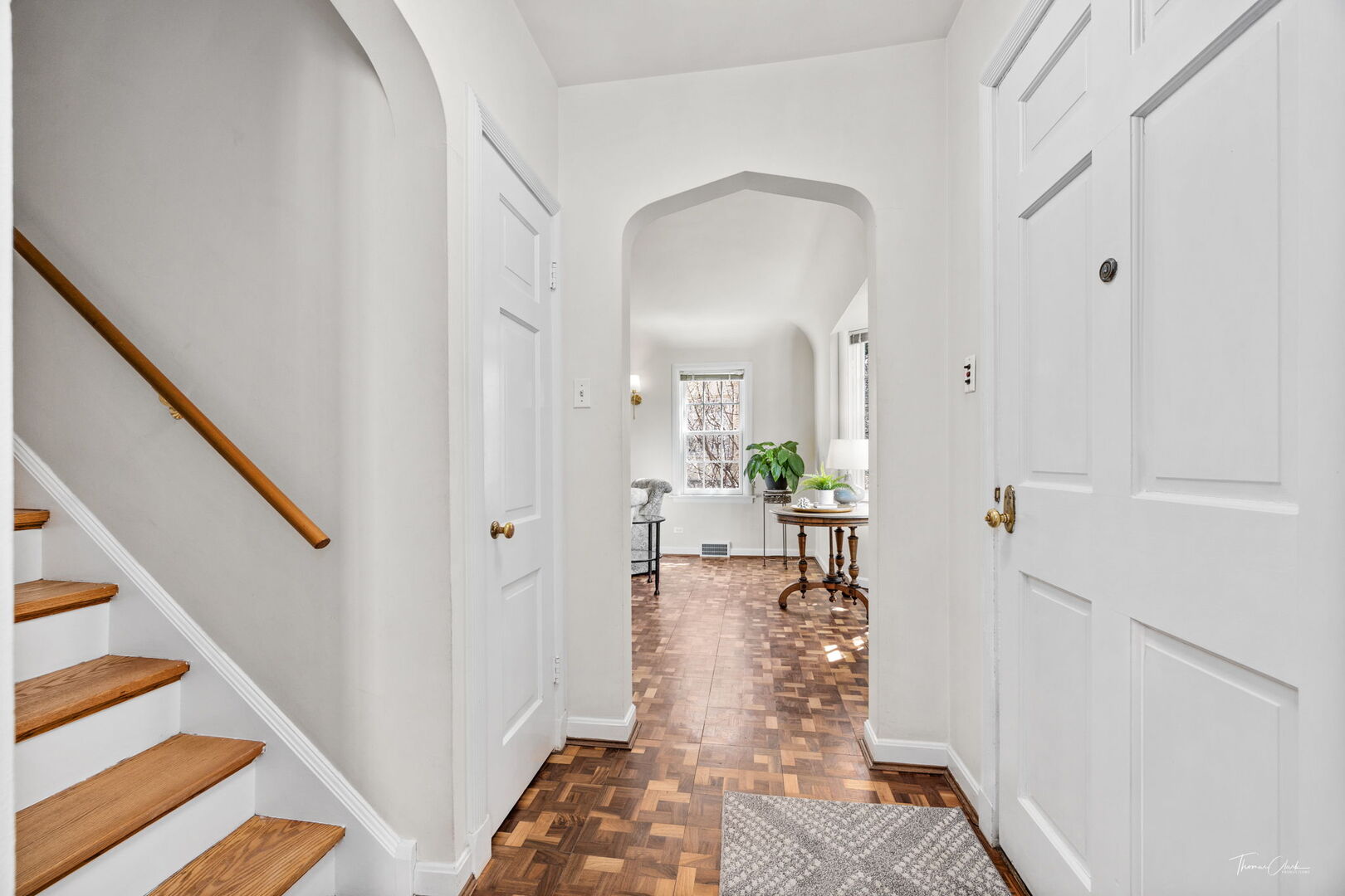 225 Maplewood Road Riverside, IL 60546 - Photo 8 of 39 a view of a hallway with wooden floor and a living room