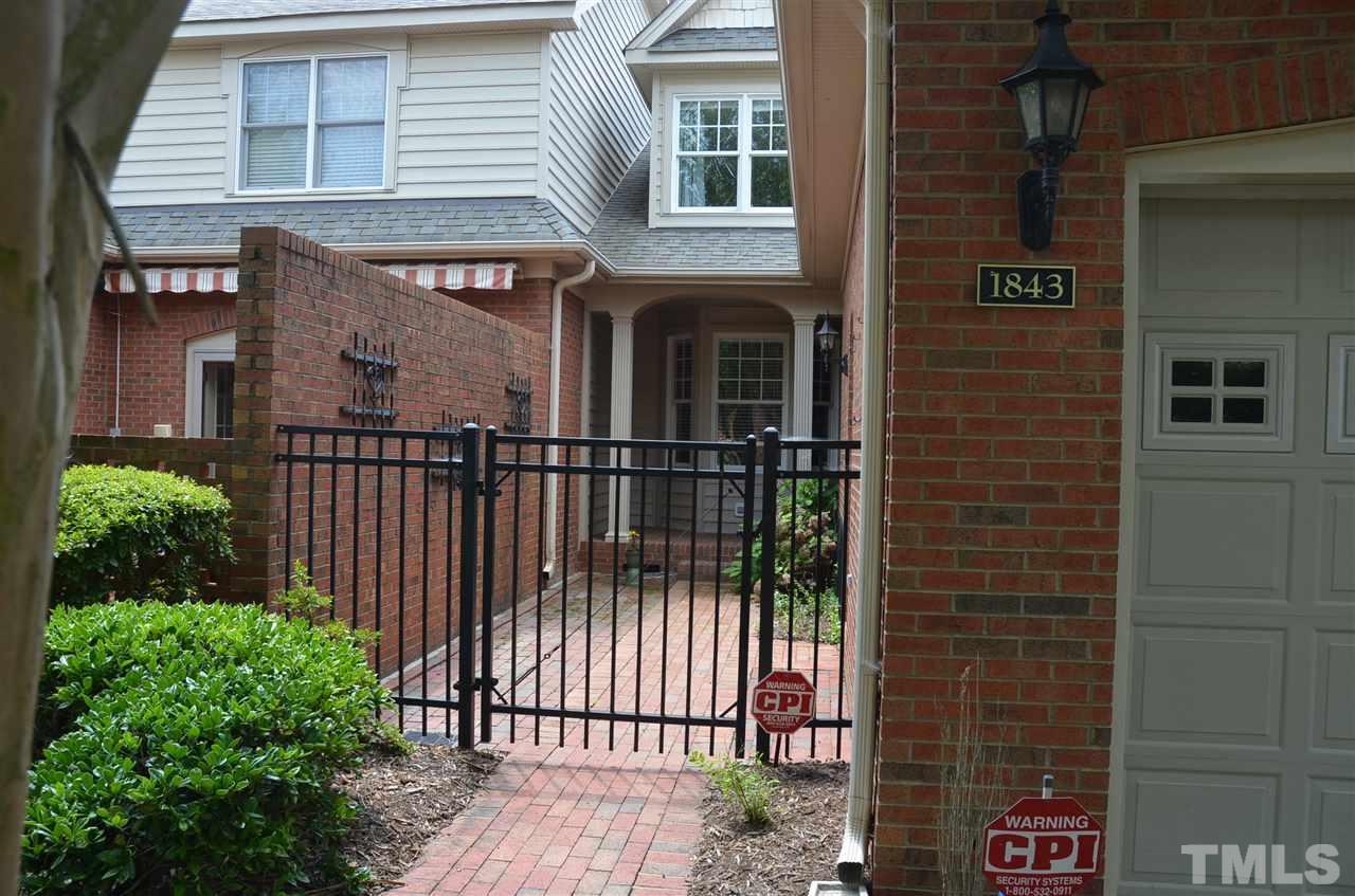 1843 Middlebrook Drive Raleigh, NC 27615 - Photo 1 of 13 a view of a brick house with many windows