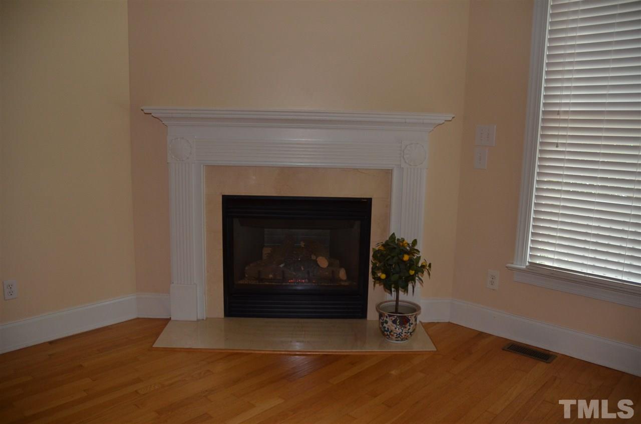 1843 Middlebrook Drive Raleigh, NC 27615 - Photo 10 of 13 a living room with a fireplace