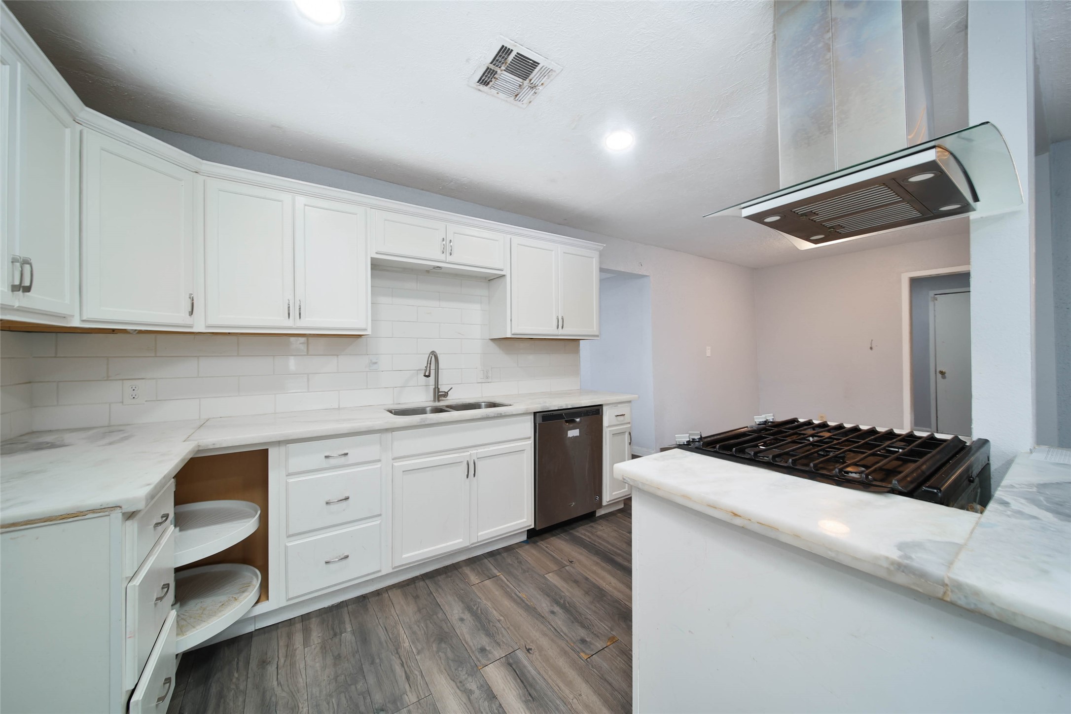 8718 Pattibob Street Houston, TX 77029 - Photo 4 of 14 a kitchen with stainless steel appliances granite countertop a sink stove and cabinets