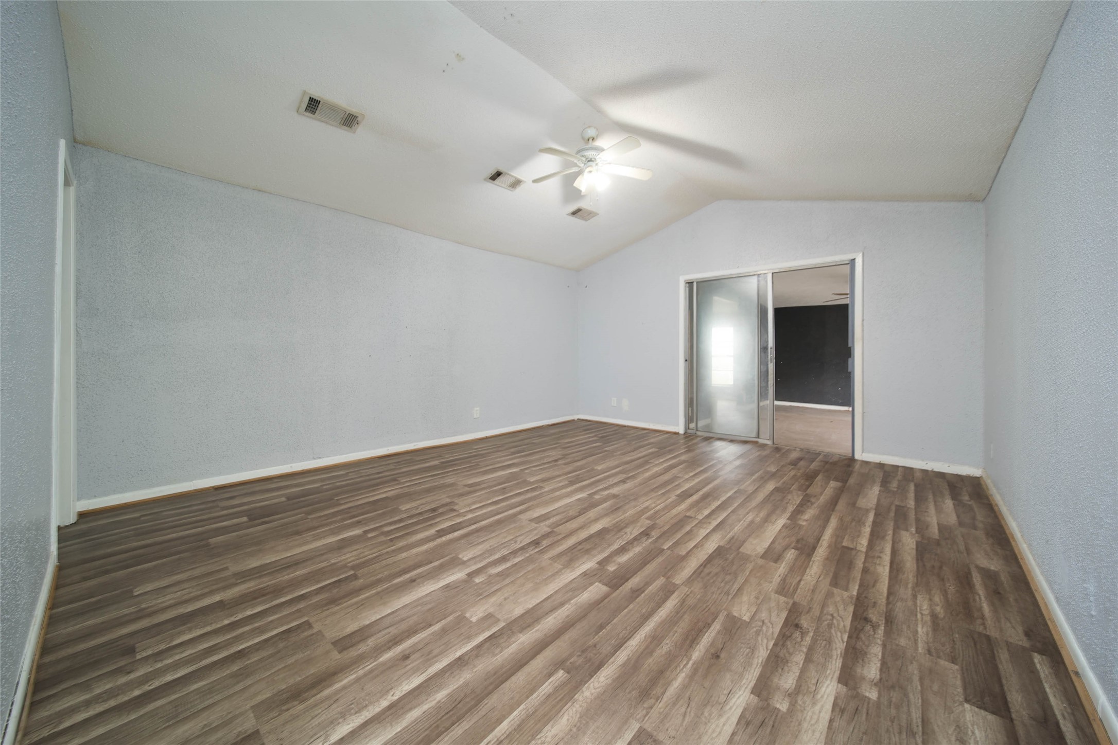 8718 Pattibob Street Houston, TX 77029 - Photo 8 of 14 wooden floor in an empty room with a window
