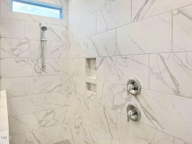 a bathroom with a sink and cabinets