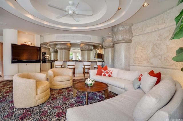 a view of a house with backyard porch and sitting area