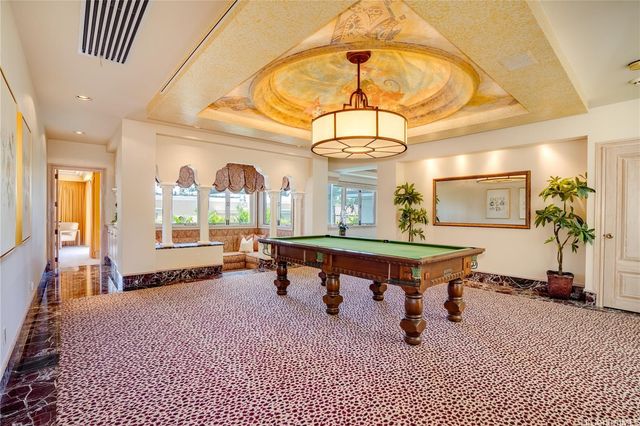 a bedroom with two beds and a flat screen tv