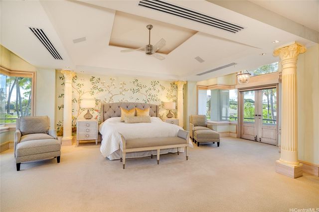 a bath tub sitting in a bathroom next to a window