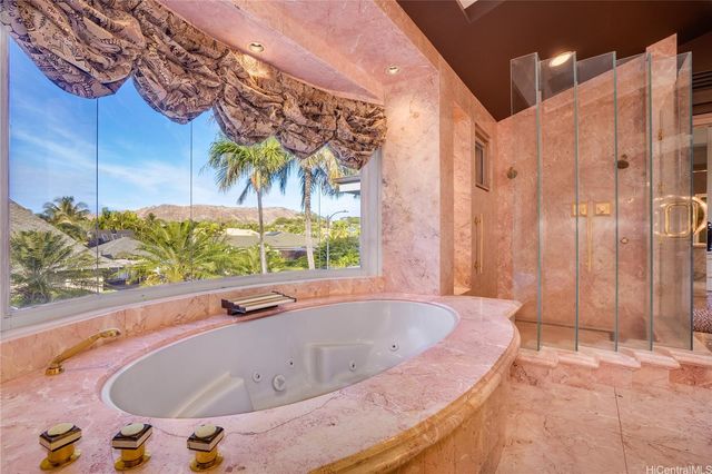 an aerial view of residential houses with city and outdoor space