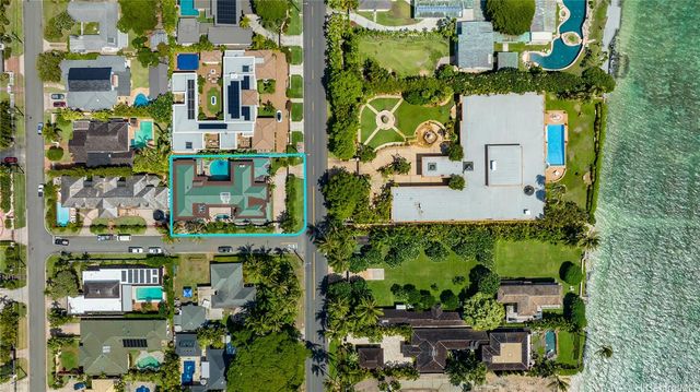 a view of a patio with couches table and chairs and potted plants