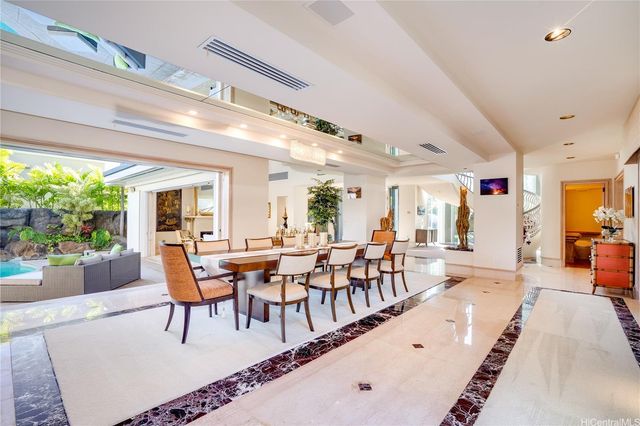 a kitchen with stainless steel appliances granite countertop wooden cabinets a sink and a stove