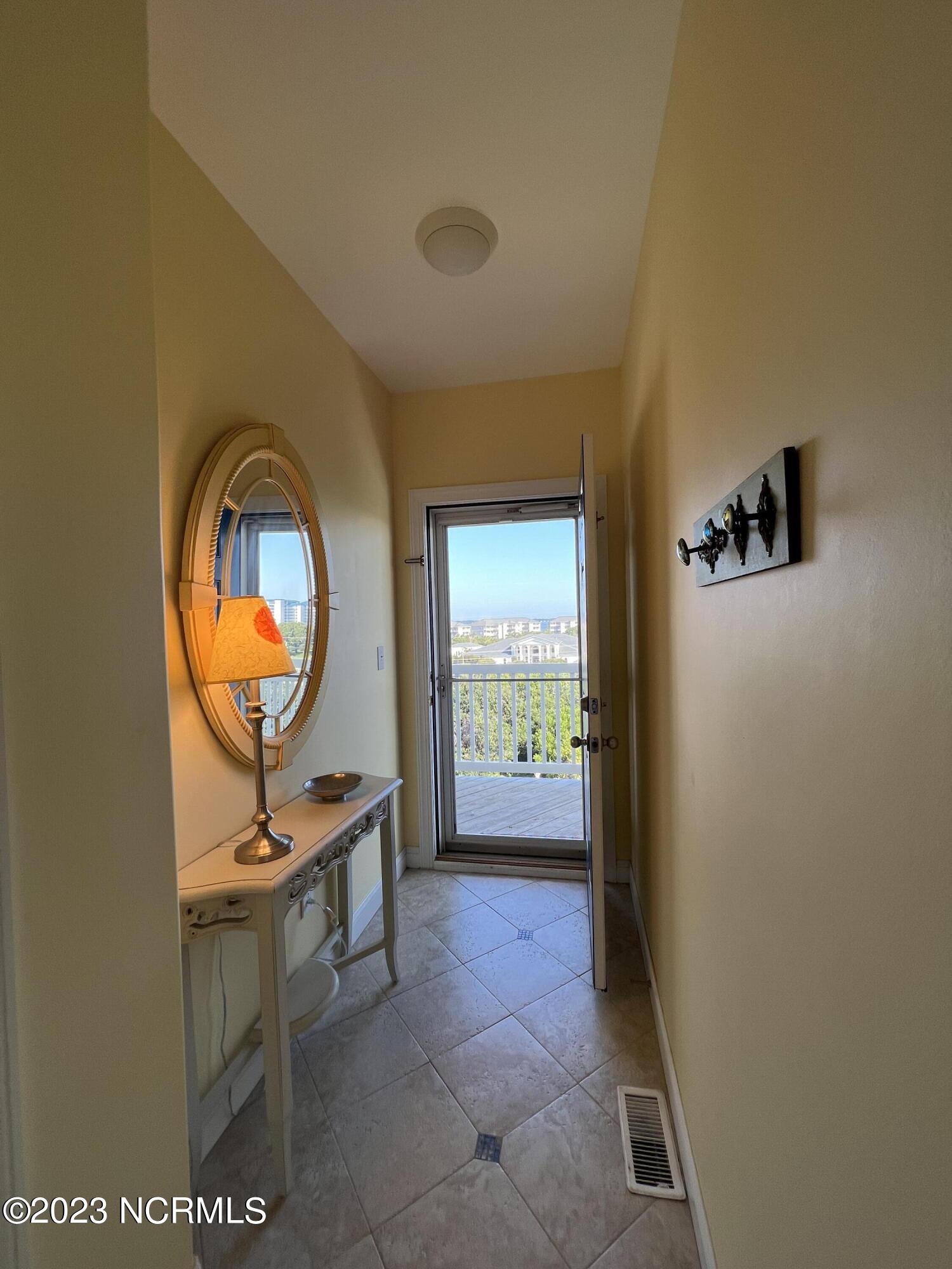 1701 Salter Path Road, Unit H 301 Indian Beach, NC 28512 - Photo 21 of 41 22 Foyer entry from sound side porch
