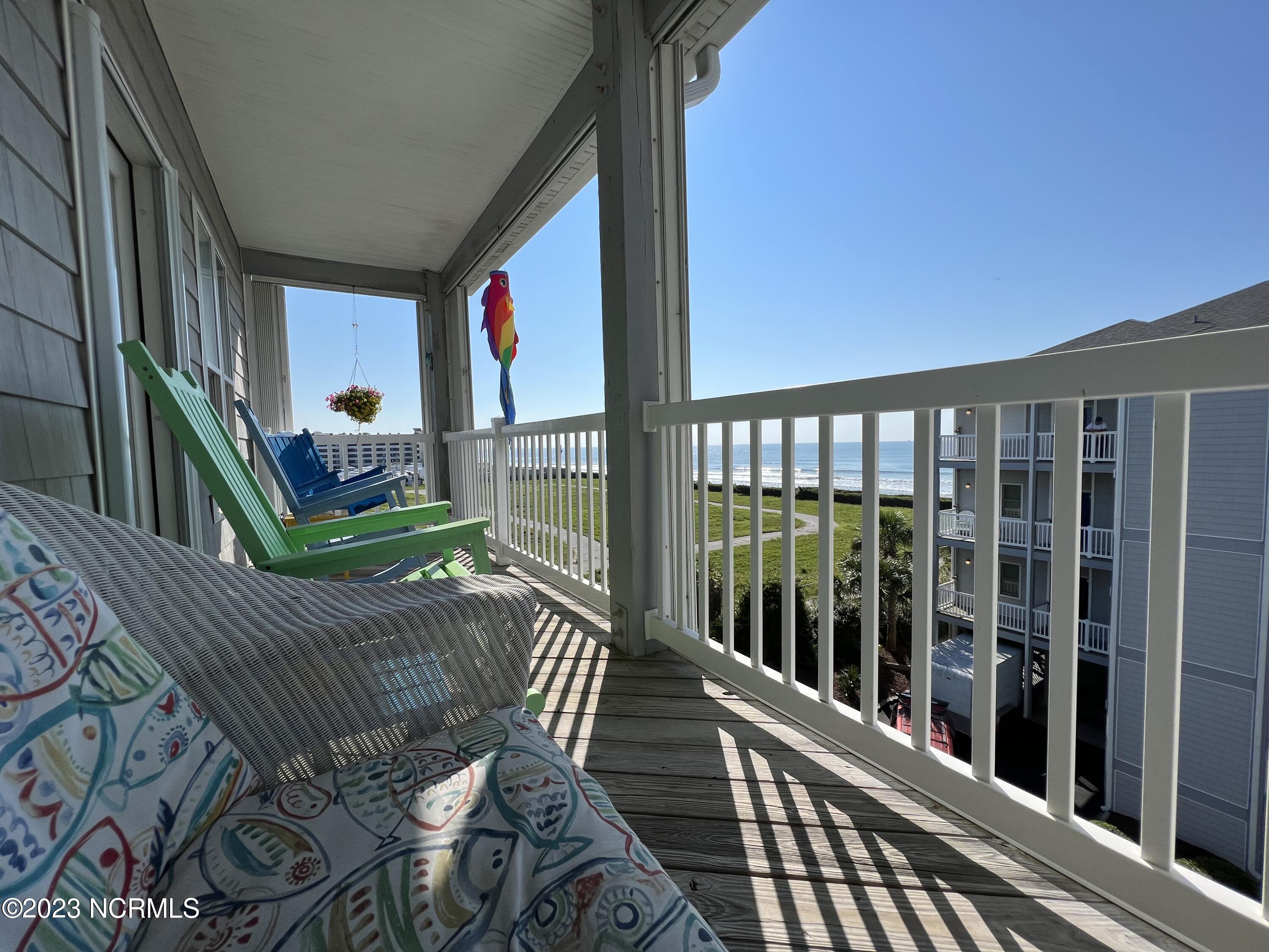 1701 Salter Path Road, Unit H 301 Indian Beach, NC 28512 - Photo 9 of 41 10 Porch off living room with ocean VIE