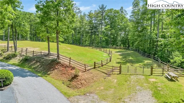 a view of a yard with swimming pool