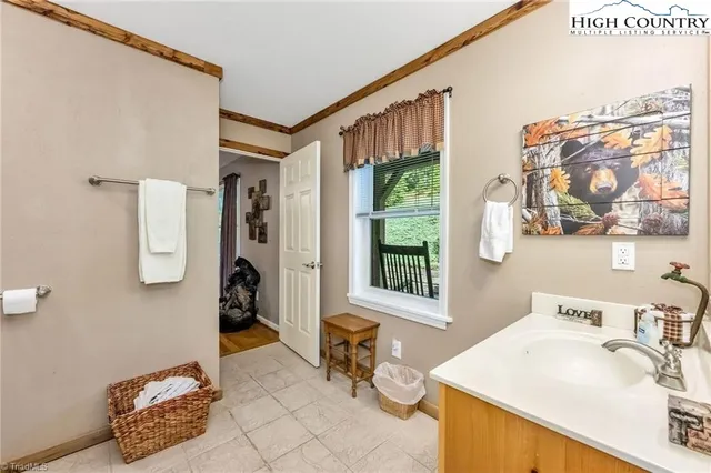 a bathroom with a sink mirror and a bathtub