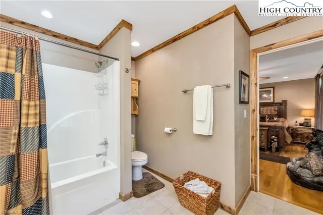 a bathroom with a tub and shower