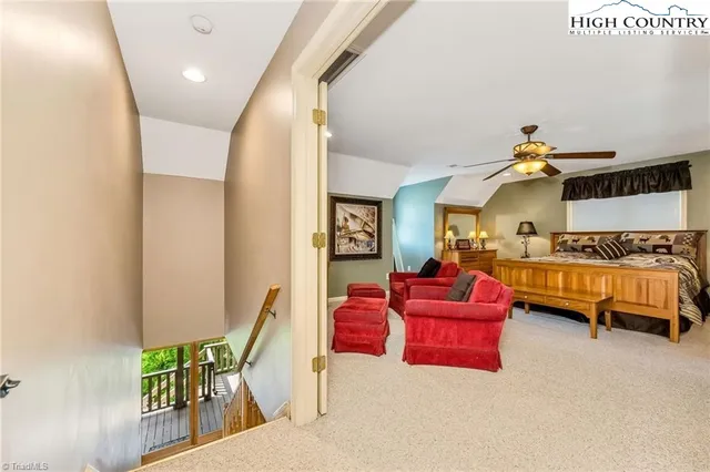 a bedroom with furniture and a wooden floor