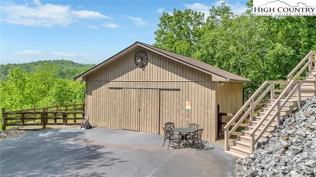 a view of backyard with a barn and a cactus plant