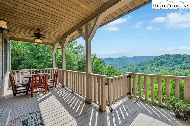 a view of balcony with wooden floor and outdoor seating