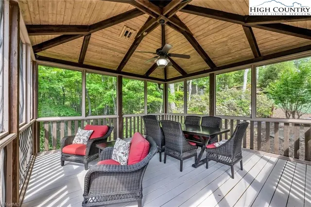 a view of a living room and outdoor seating