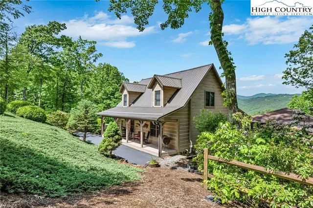 an front view of a house with garden