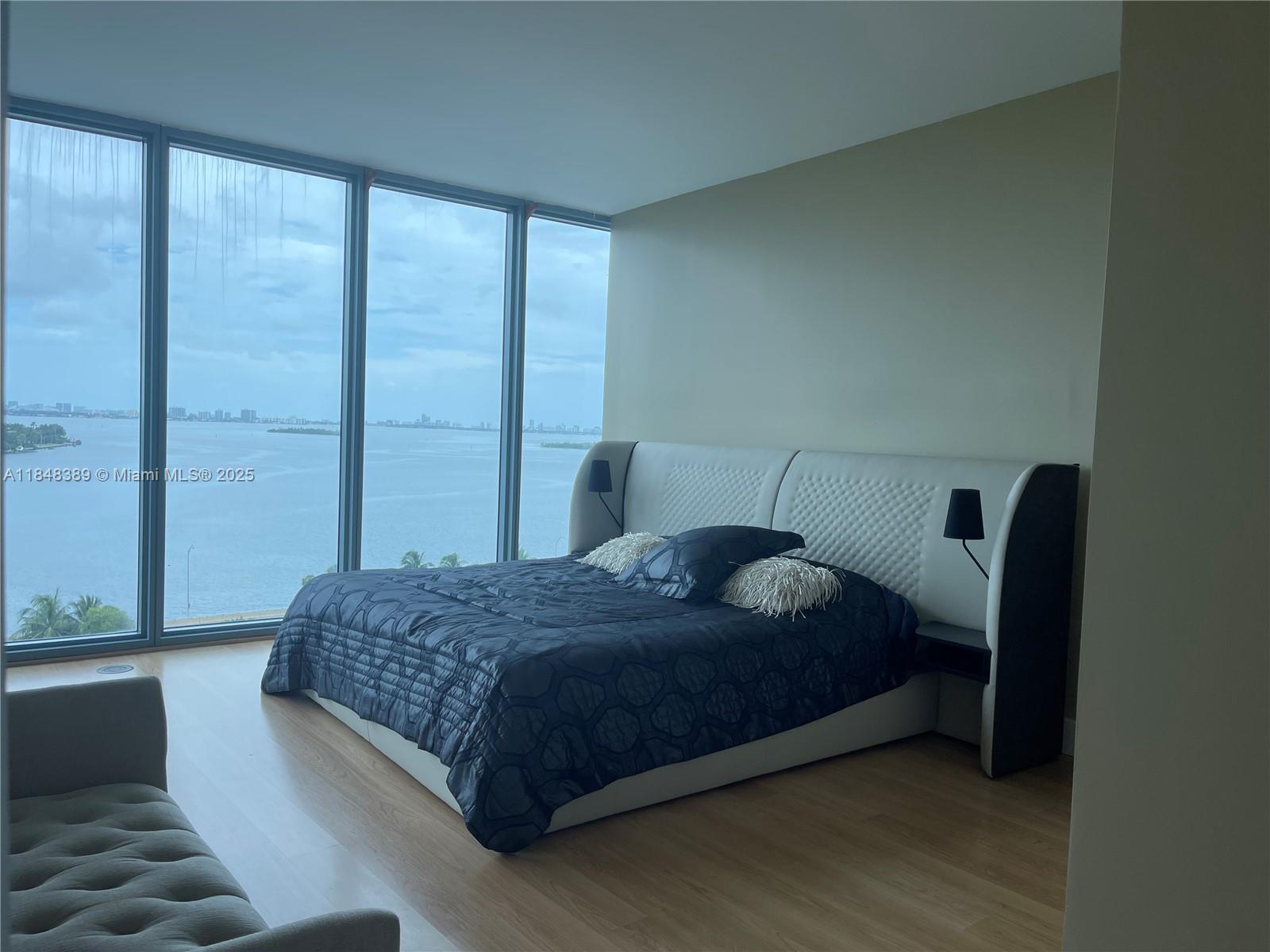 601 Northeast 36th Street, Unit 1009 Miami, FL 33137 - Photo 10 of 19 a bedroom with a bed and a window