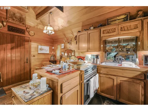 a kitchen that has a lot of cabinets in it
