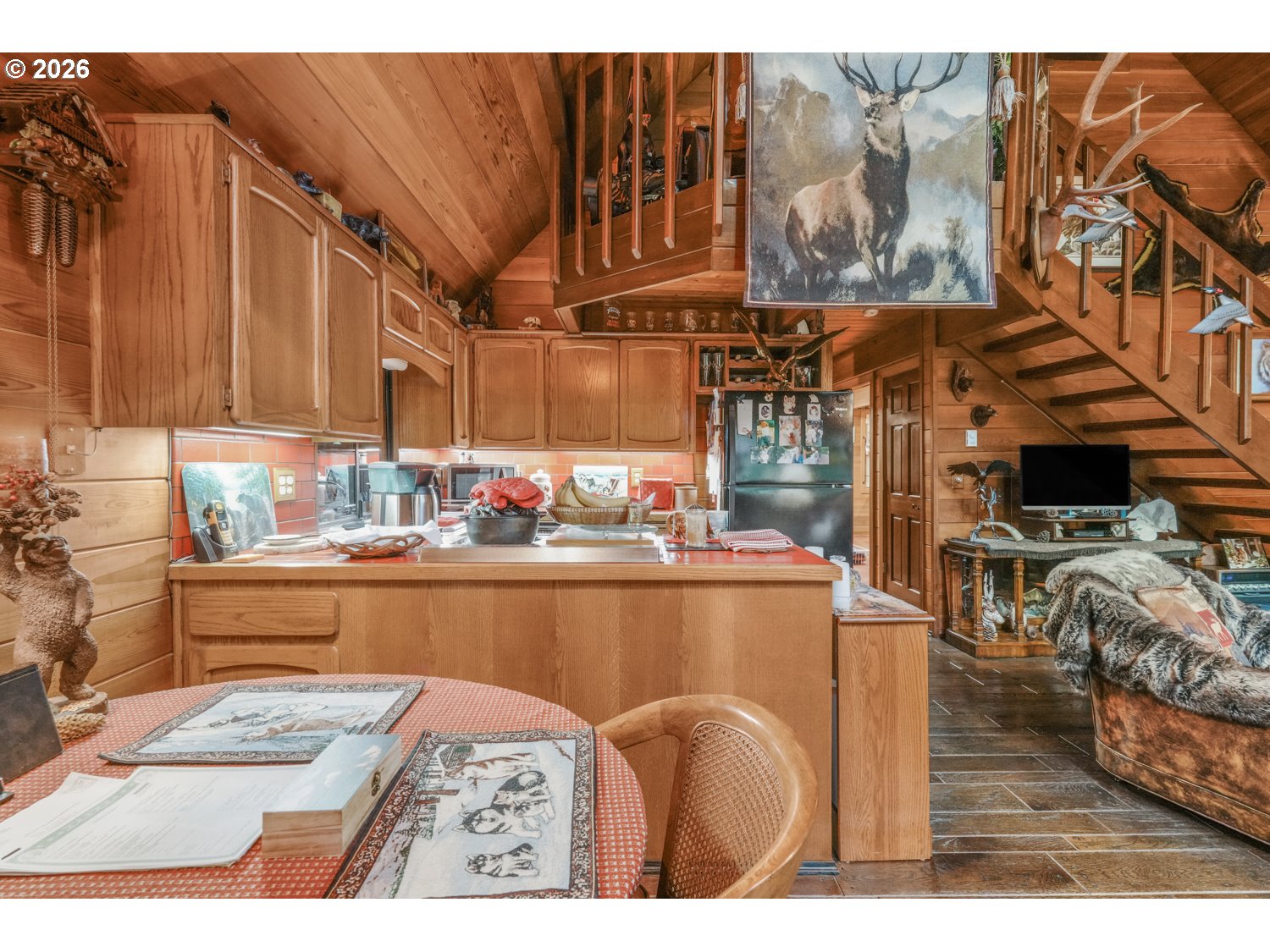 15202 Washougal River Road Washougal, WA 98671 - Photo 16 of 32 a kitchen with stainless steel appliances kitchen island granite countertop a sink and cabinets
