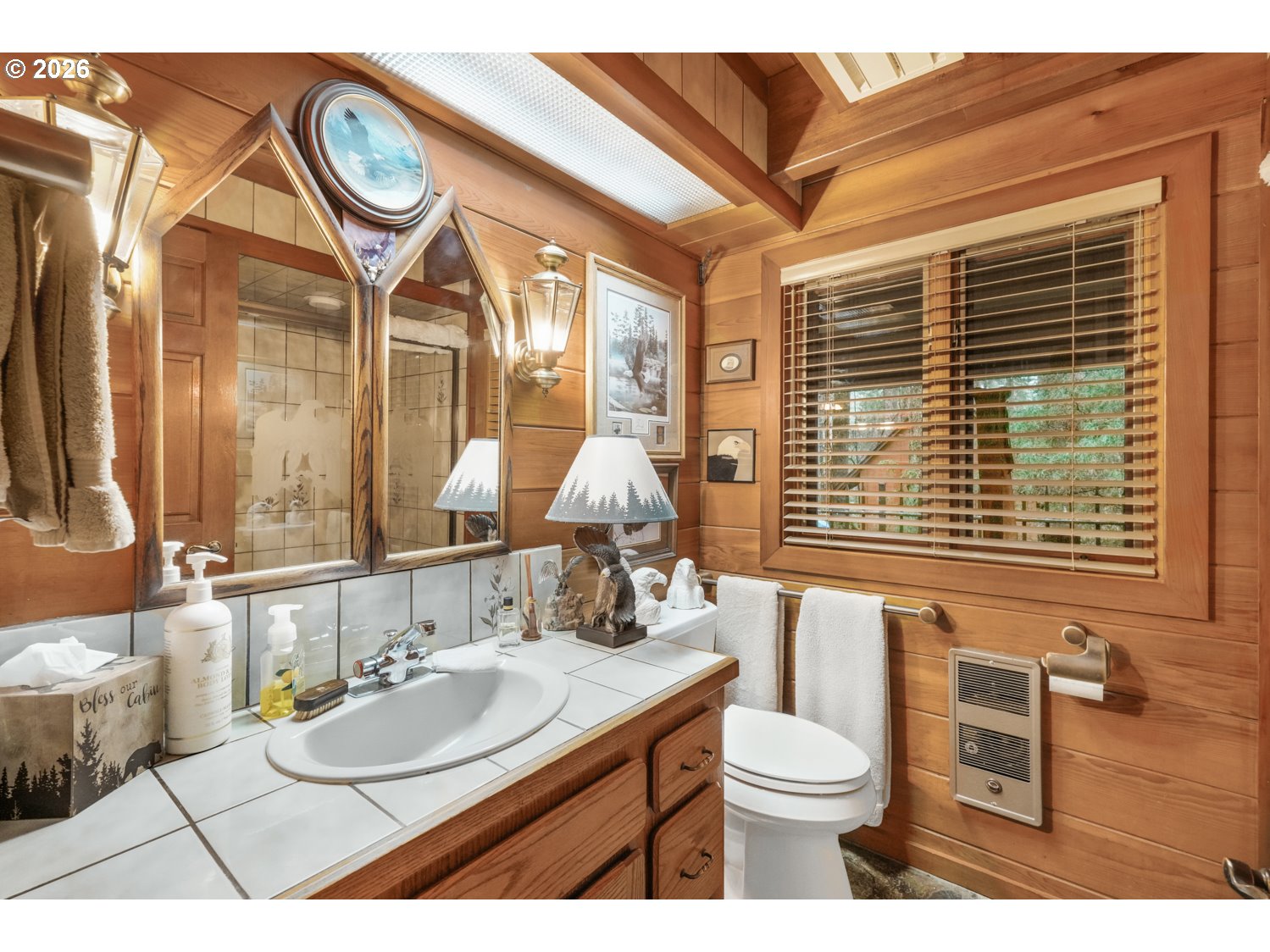 15202 Washougal River Road Washougal, WA 98671 - Photo 20 of 32 a bathroom with a toilet sink and mirror