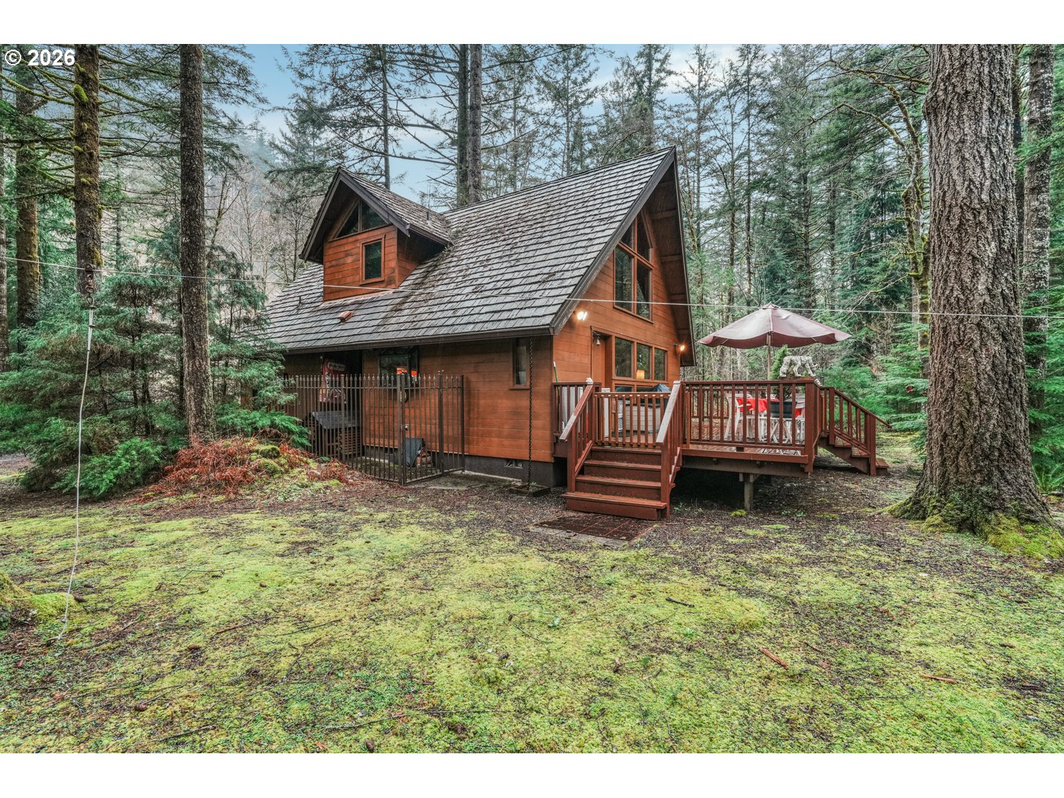 15202 Washougal River Road Washougal, WA 98671 - Photo 2 of 32 a view of a house with a yard balcony and furniture