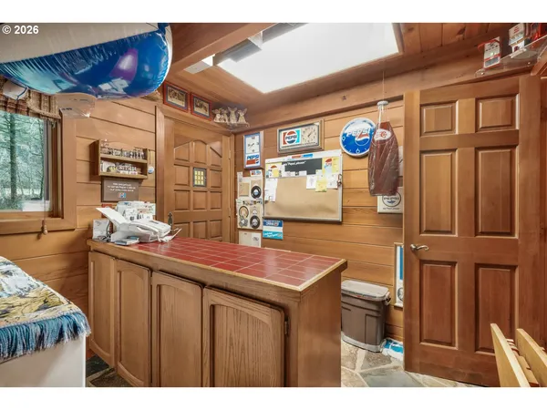 a kitchen with stainless steel appliances wooden cabinets a stove and a refrigerator