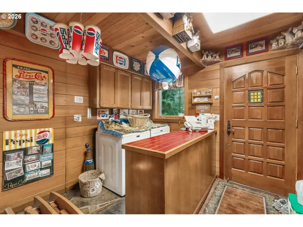 a kitchen with stainless steel appliances kitchen island granite countertop a refrigerator and a stove