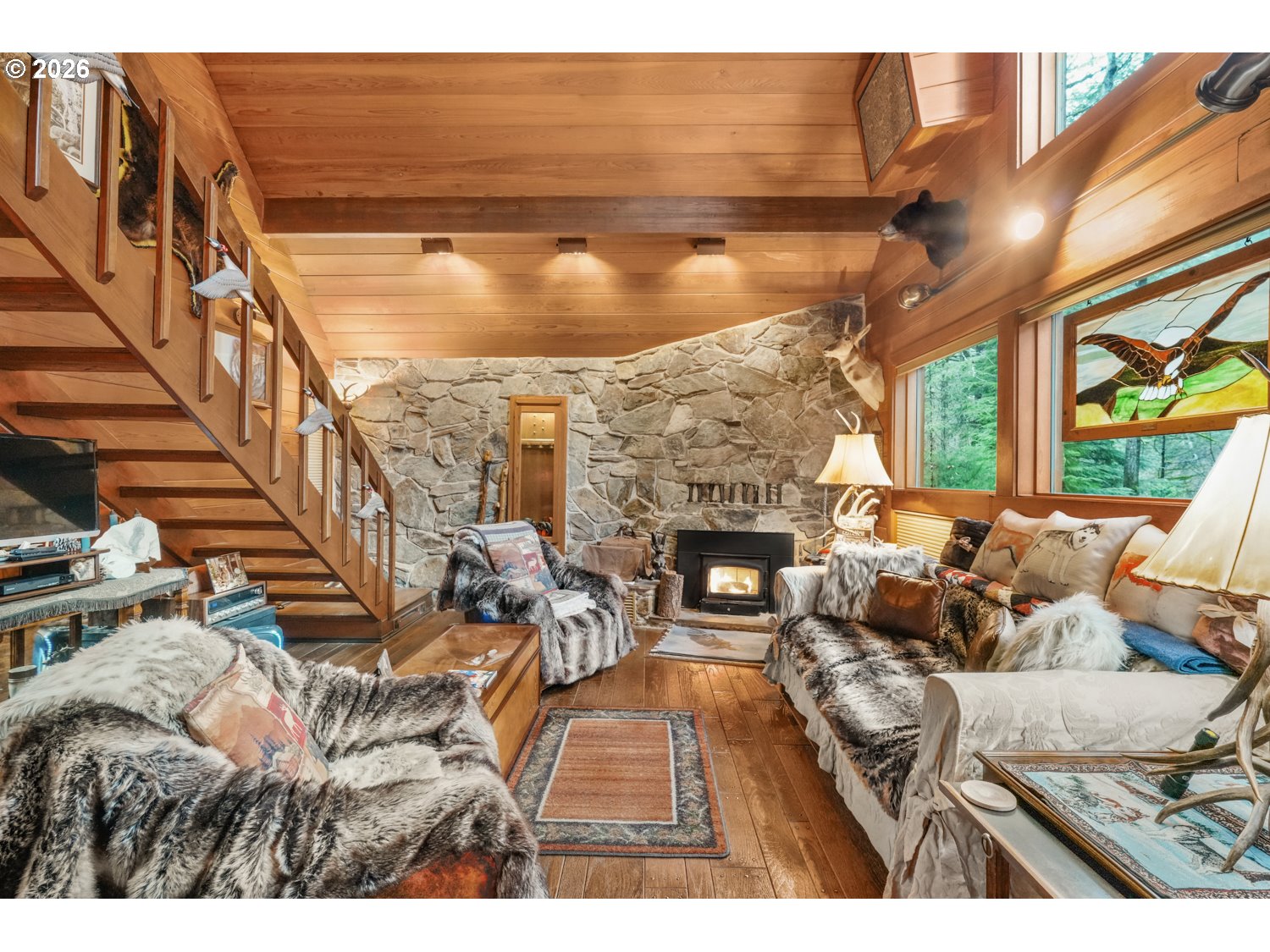 15202 Washougal River Road Washougal, WA 98671 - Photo 8 of 32 a living room with fireplace furniture and a floor to ceiling window