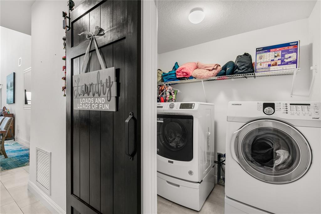 5637 Beggs Road St. Cloud, FL 34771 - Photo 11 of 35 a utility room with dryer and washer
